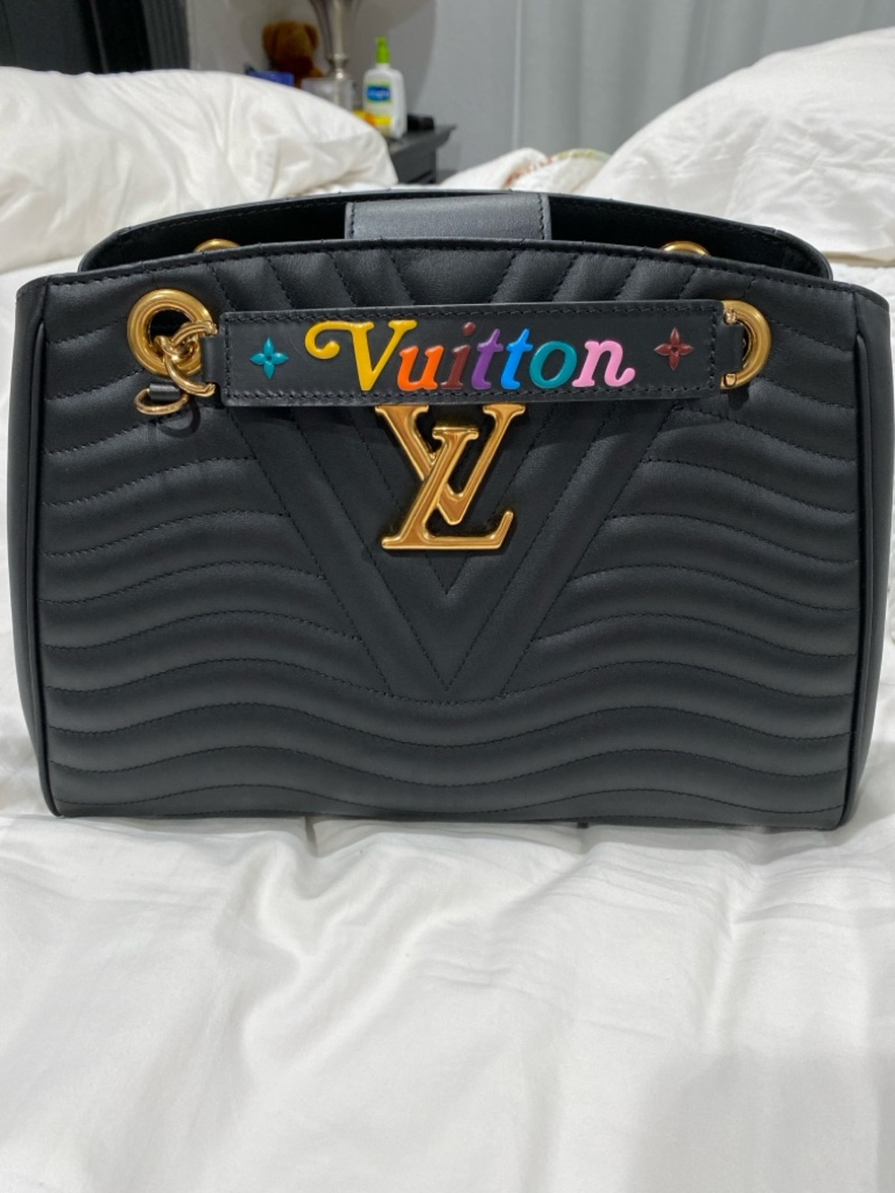Louis Vuitton Black Quilted Leather Handbag with Multicolor 'Vuitton' Accent